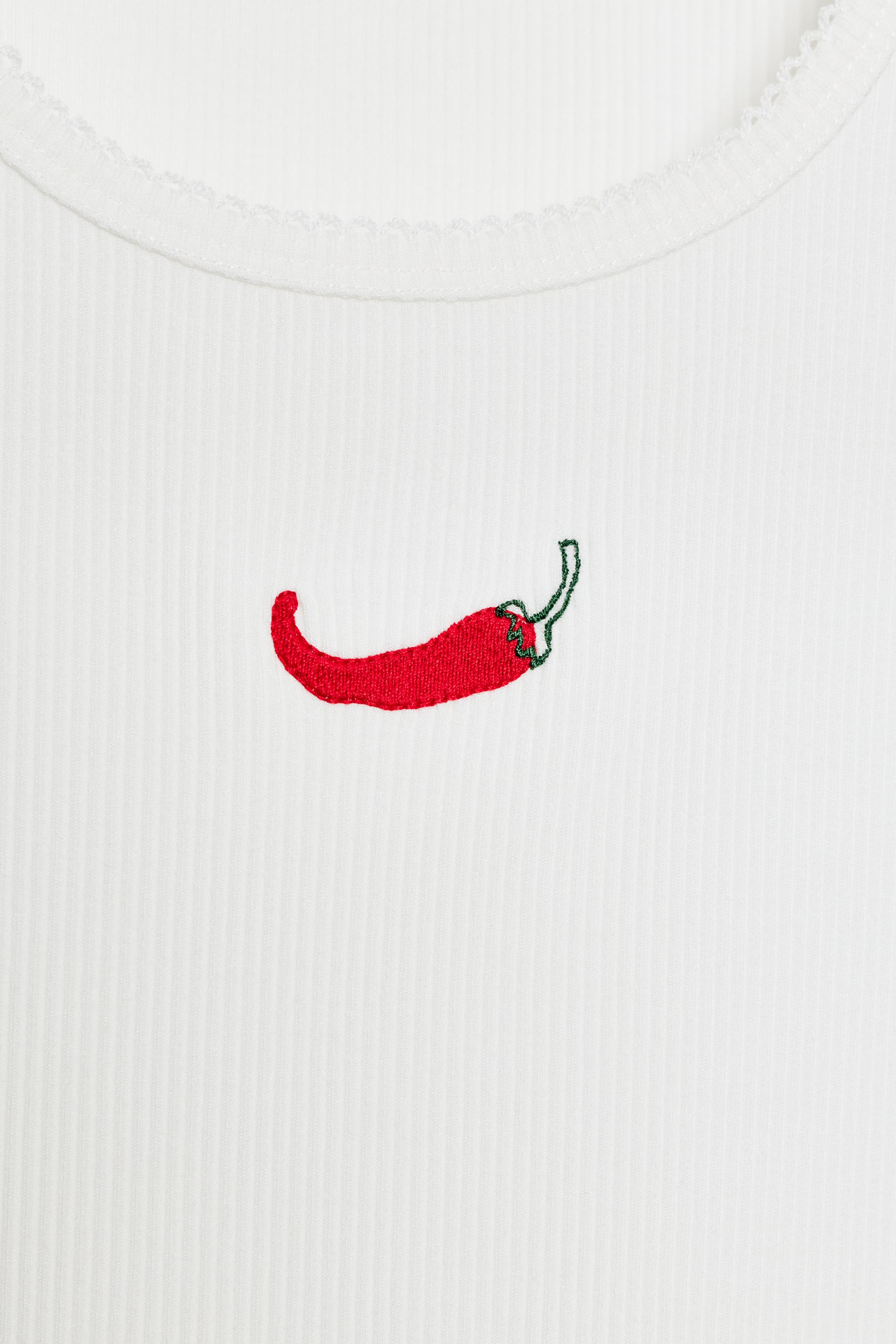 EMBROIDERED FRONT TOP
